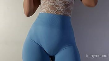 Play Puffy pussy girl in blue leggings and a big tits showing off.